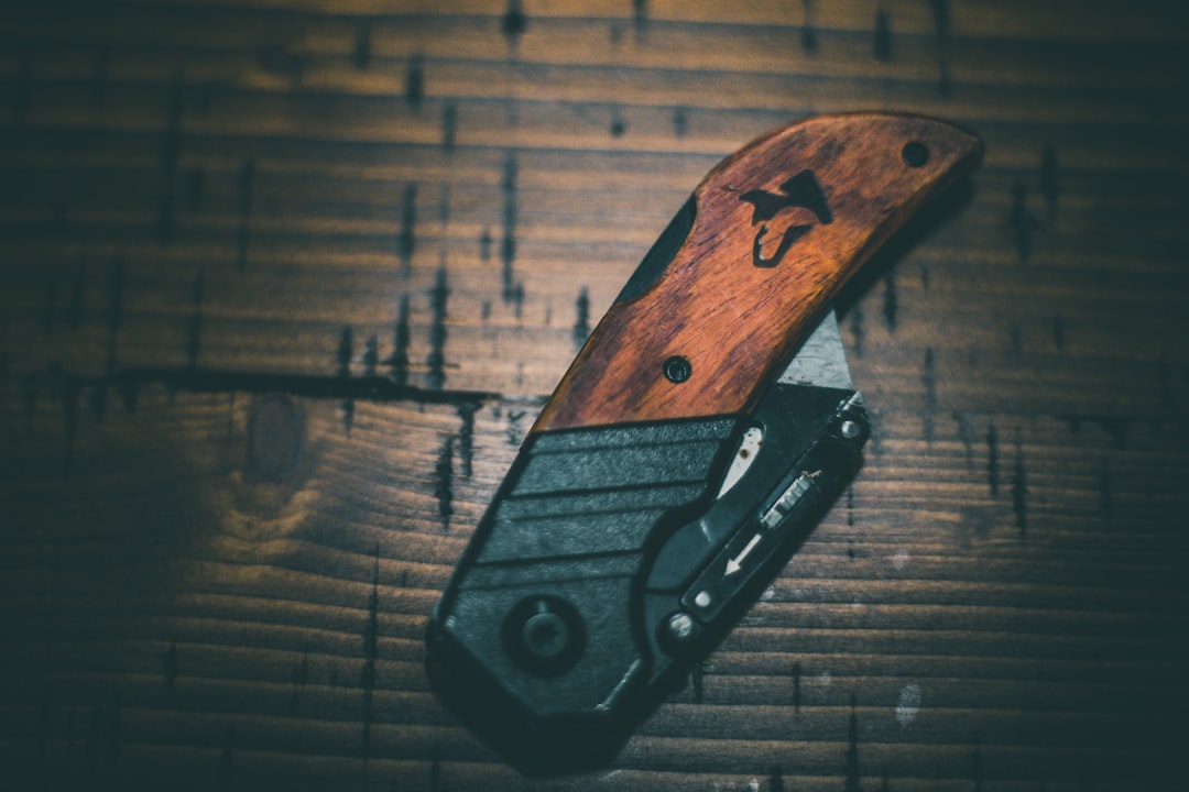 black and brown folding knife