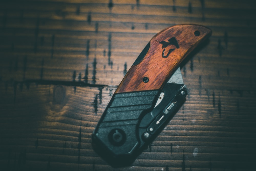 black and brown folding knife