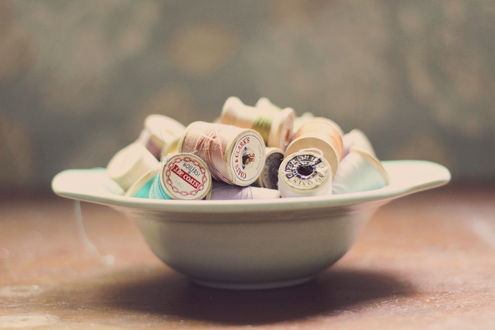 white and brown cupcakes on white ceramic bowl