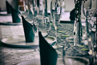 Close-up of a beautifully arranged table setting with champagne and floral accents.