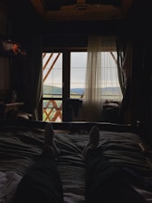 A serene scene of a traveler relaxing in a cozy, well-located Asian guesthouse.