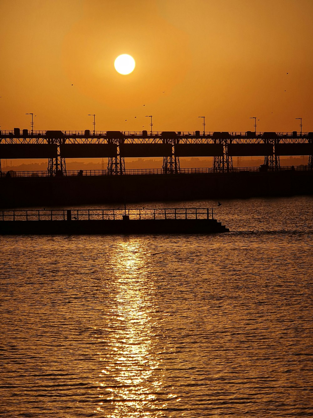 silhouette of bridge during sunset