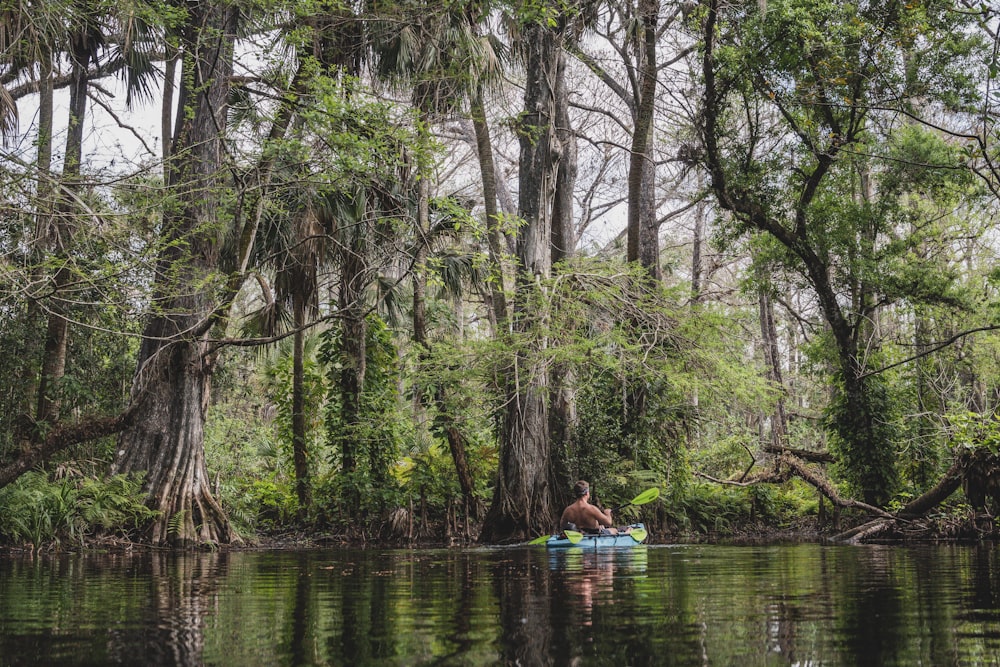 2 person riding on boat on river during daytime