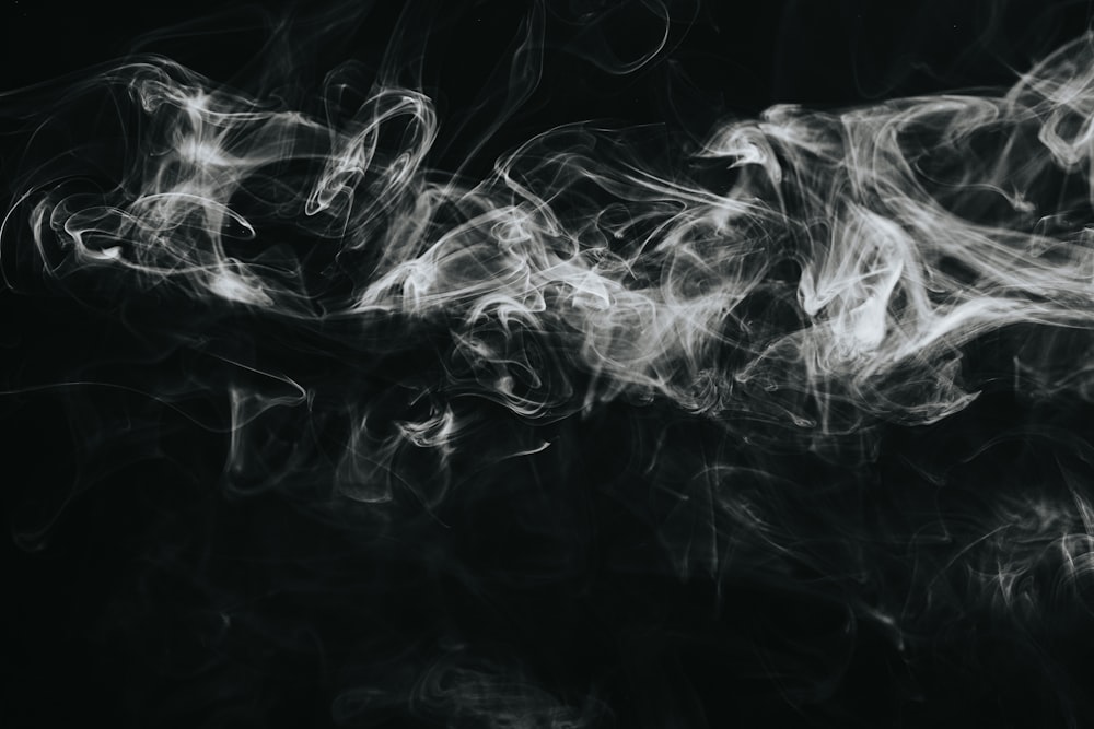 white smoke on black background