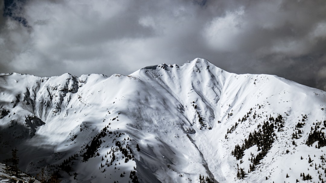 snow covered mountain under cloudy sky during daytime, Pyramid Peak