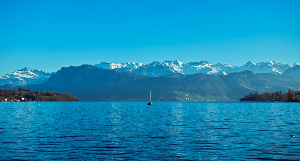 person in boat on sea during daytime