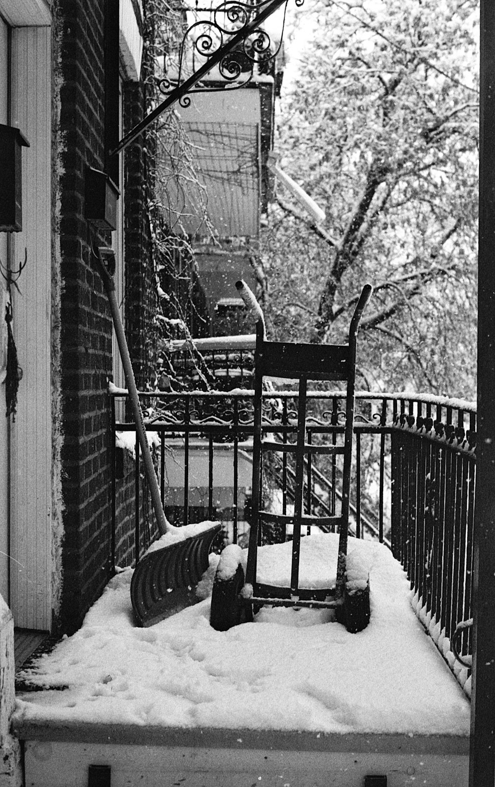 black metal ladder leaning on wall