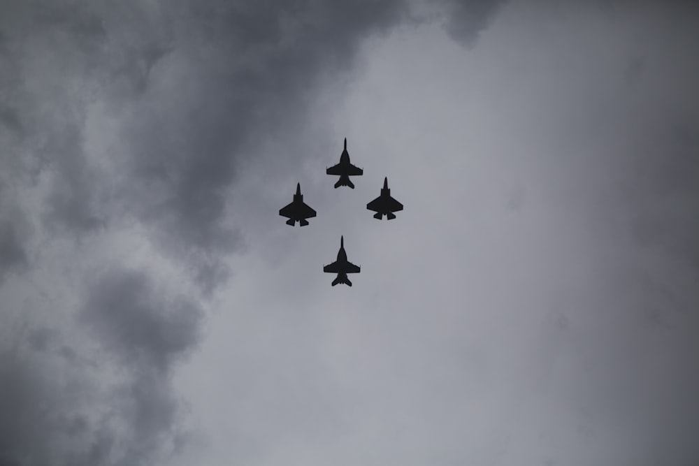 four fighter planes in mid air