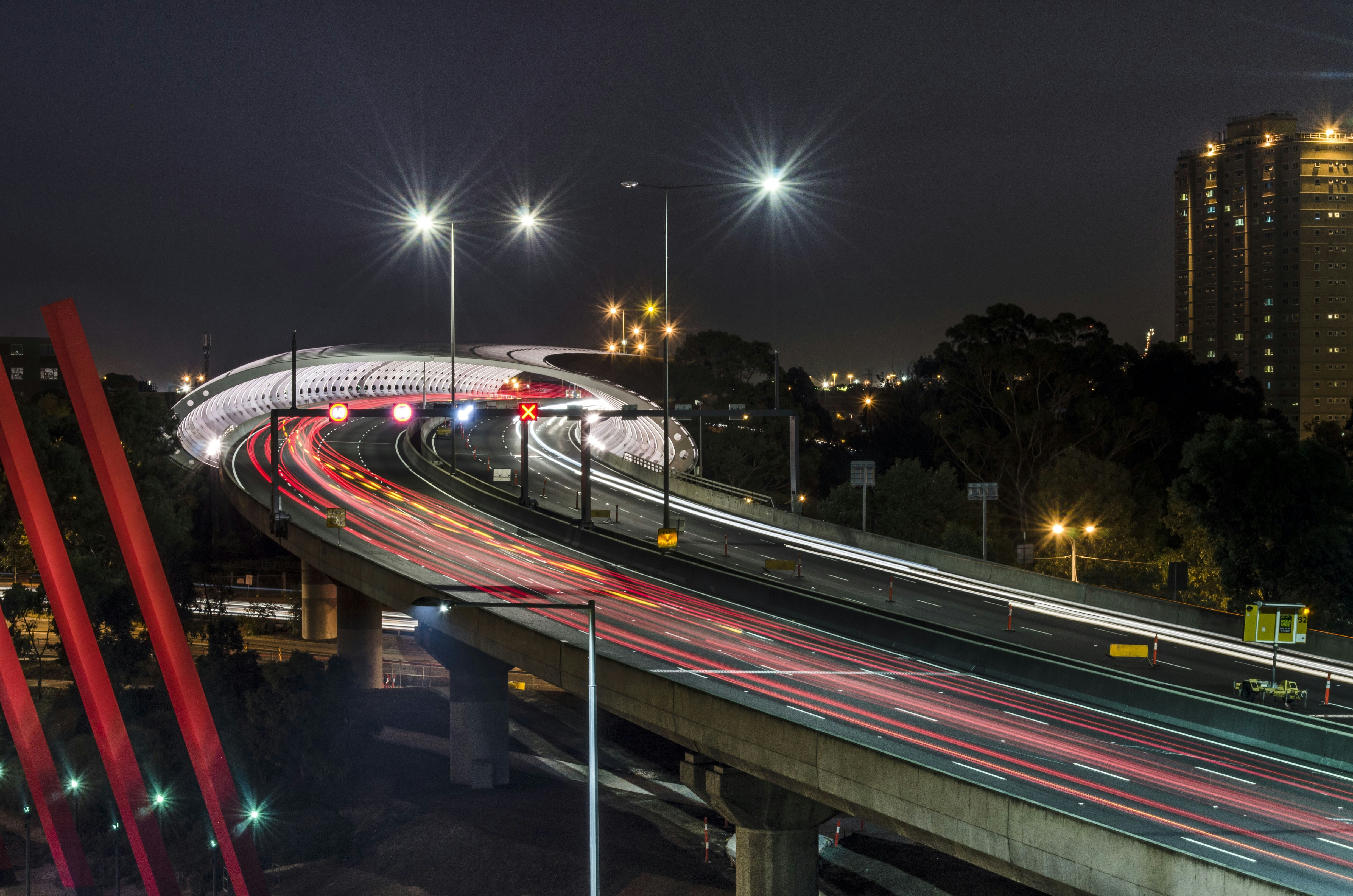 time lapse photography of cars on road during night time