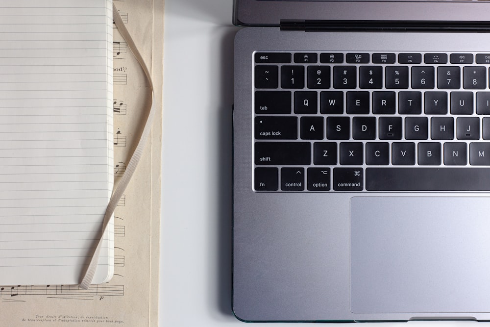 gray laptop computer on white table