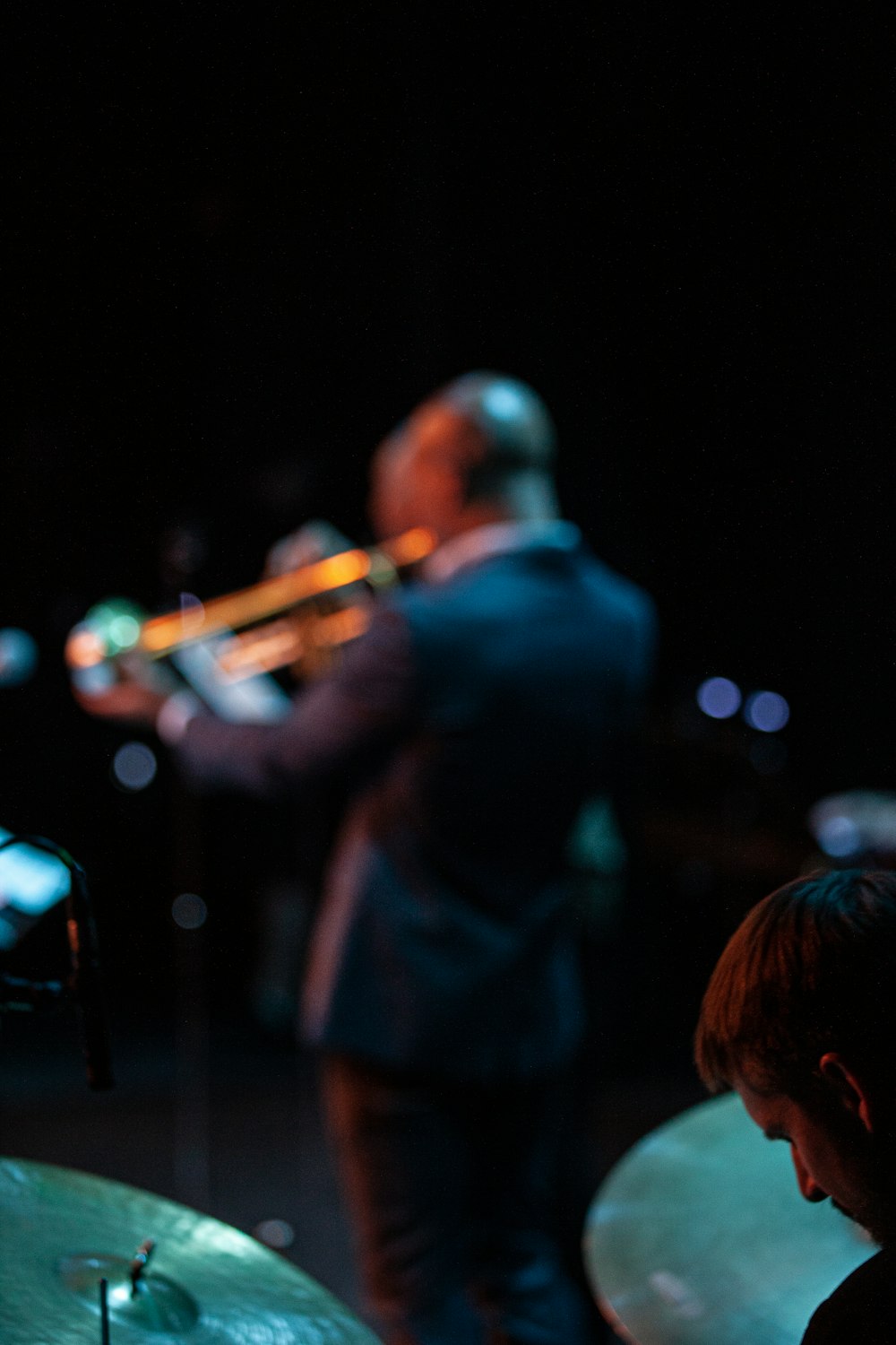 man playing trumpet on stage
