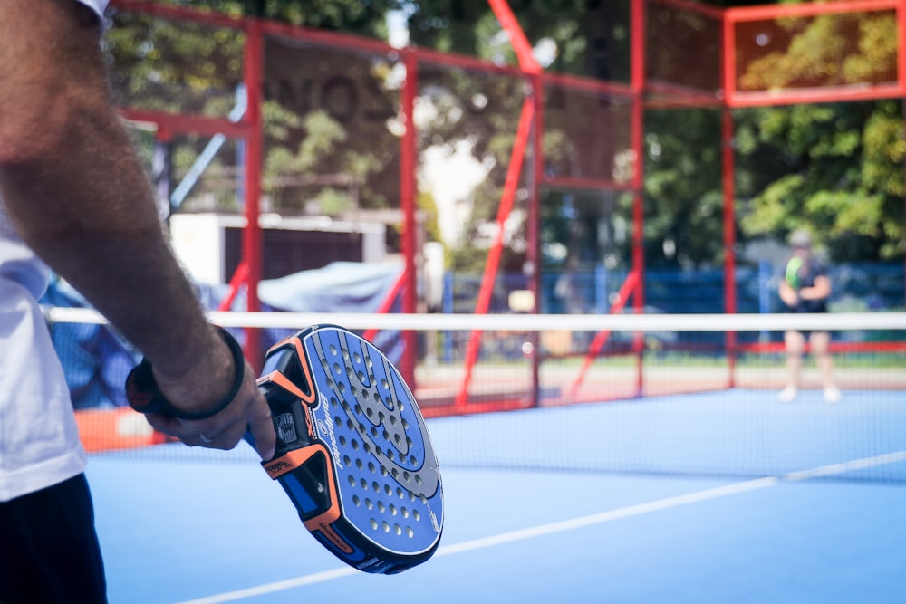 person wearing blue and white sneakers