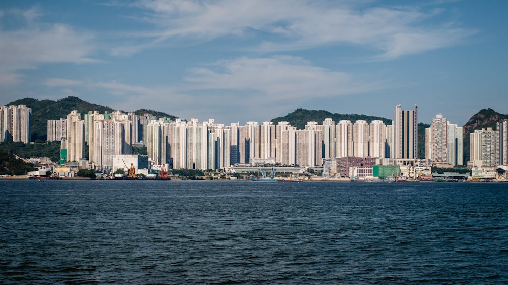 city skyline across body of water during daytime