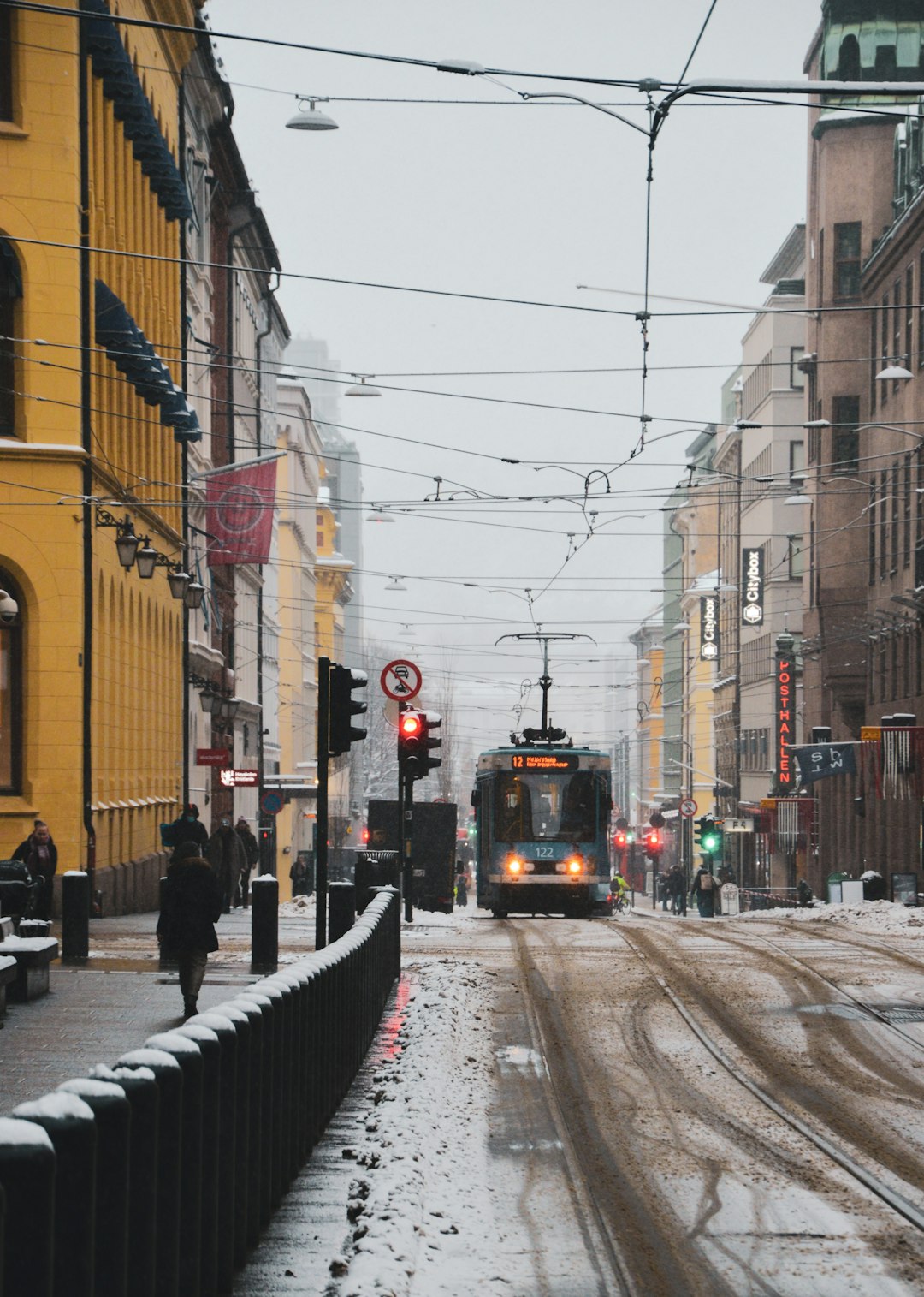 yellow tram on road near buildings during daytime