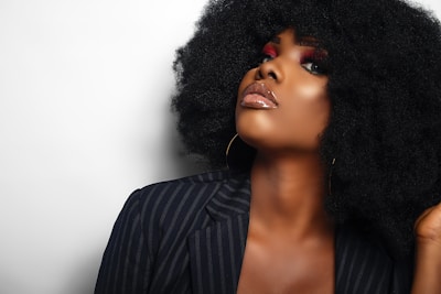 woman in black and white pinstripe blazer