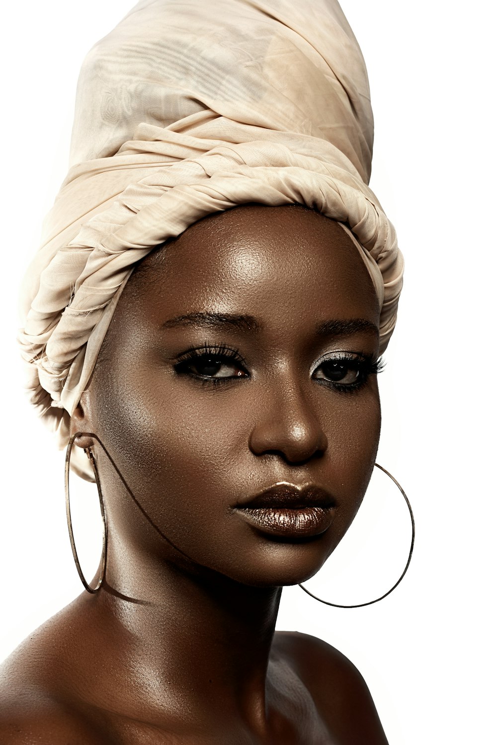 woman with white hair and wearing white head band