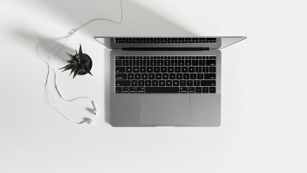 macbook pro on white table