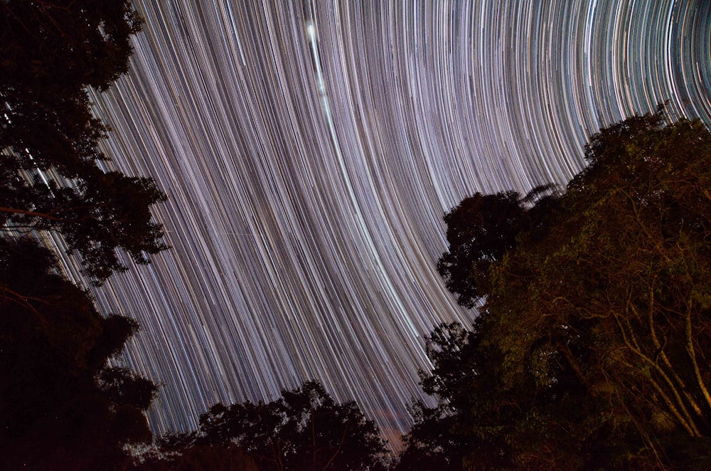 time lapse photography of stars in the sky during daytime