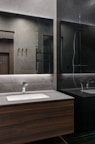 Modern bathroom with sleek fixtures and a large mirror.