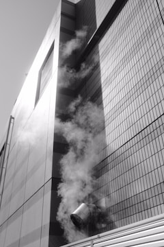 Before and after photo of a building facade cleaned with high-pressure water and steam.