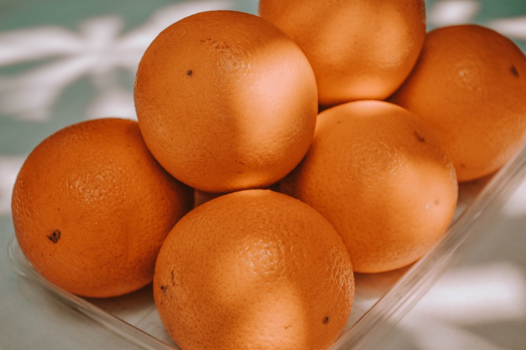 orange fruit on clear glass tray