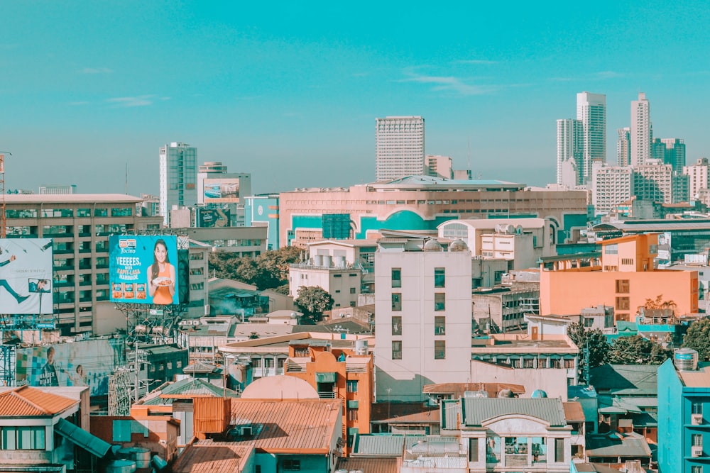 city buildings under blue sky during daytime