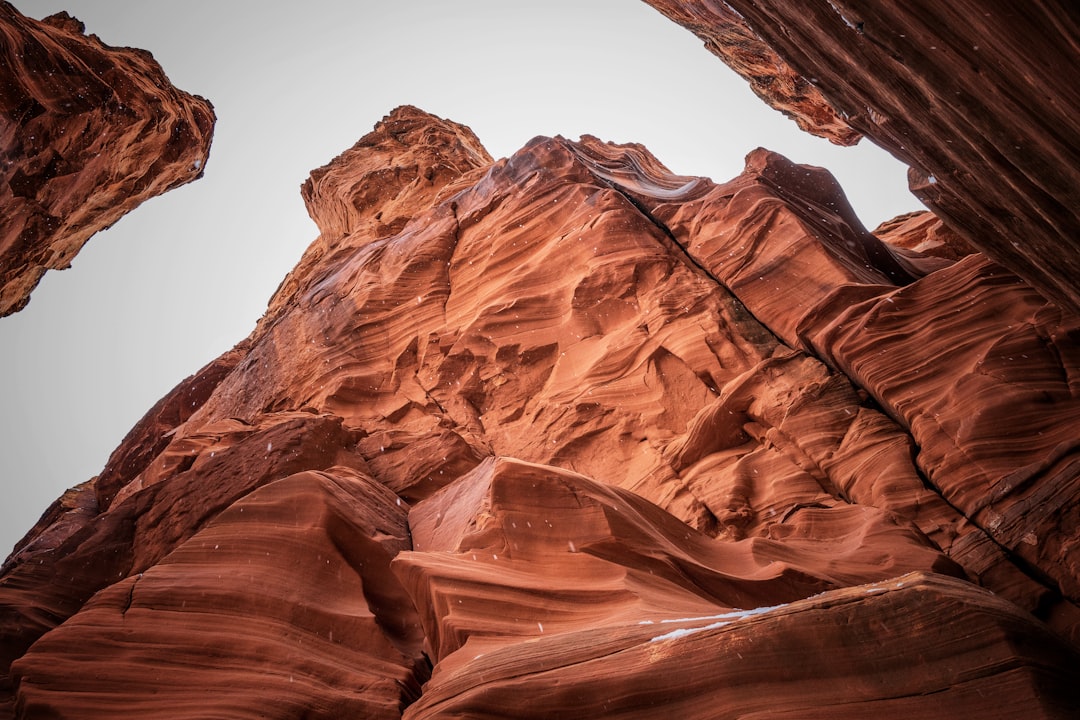 brown rock formation under white sky during daytime