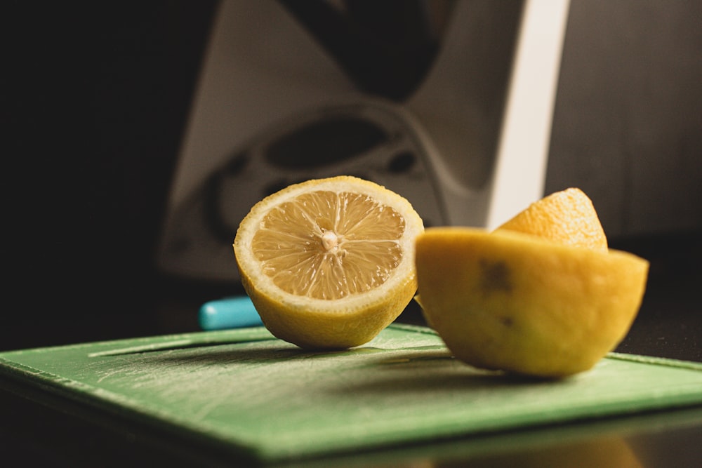 yellow lemon fruit on green table