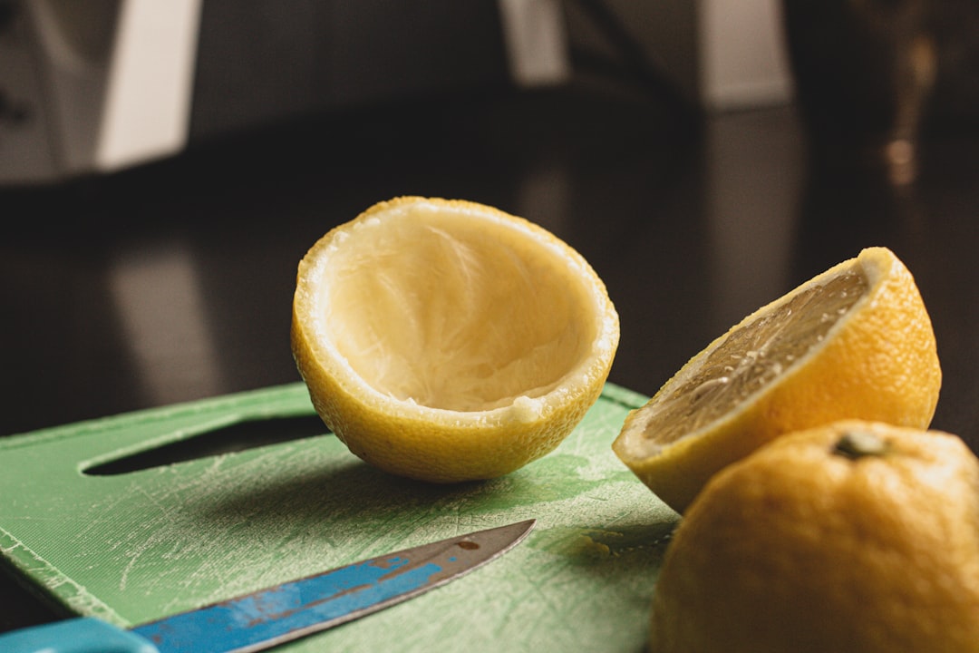sliced lemon on green textile