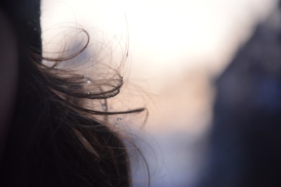 Close-up of shiny, hydrated hair strands reflecting light beautifully