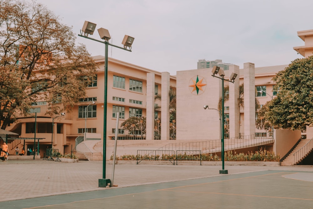 black street light near brown concrete building during daytime