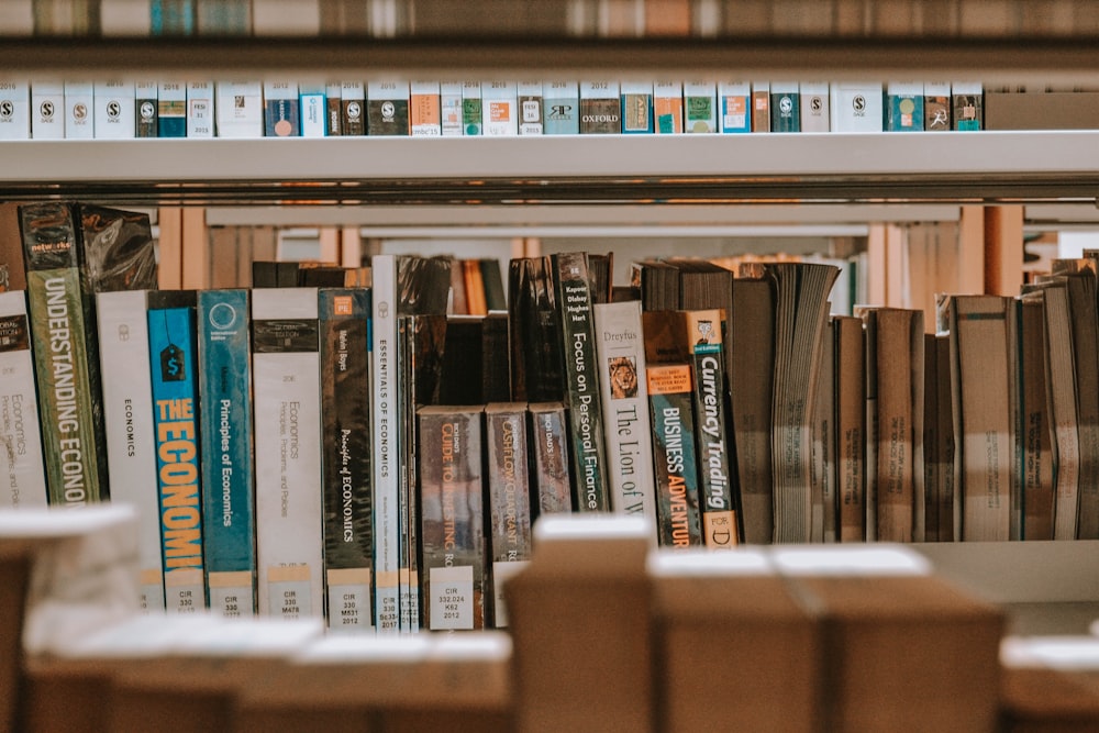 books on brown wooden shelf