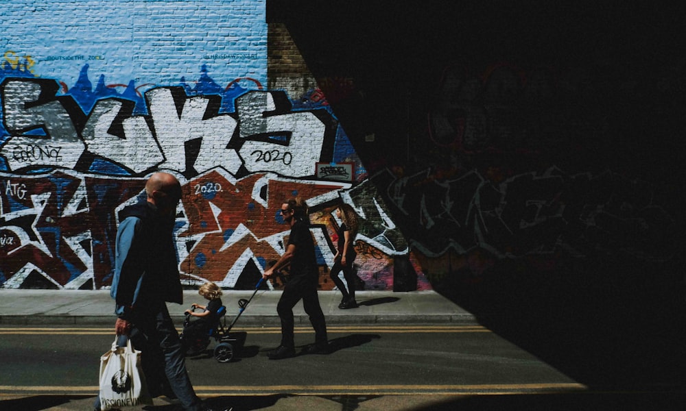 people walking on sidewalk during daytime