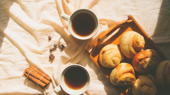 A cozy kitchen scene with traditional Polish dishes and a steaming cup of coffee ready for delivery.