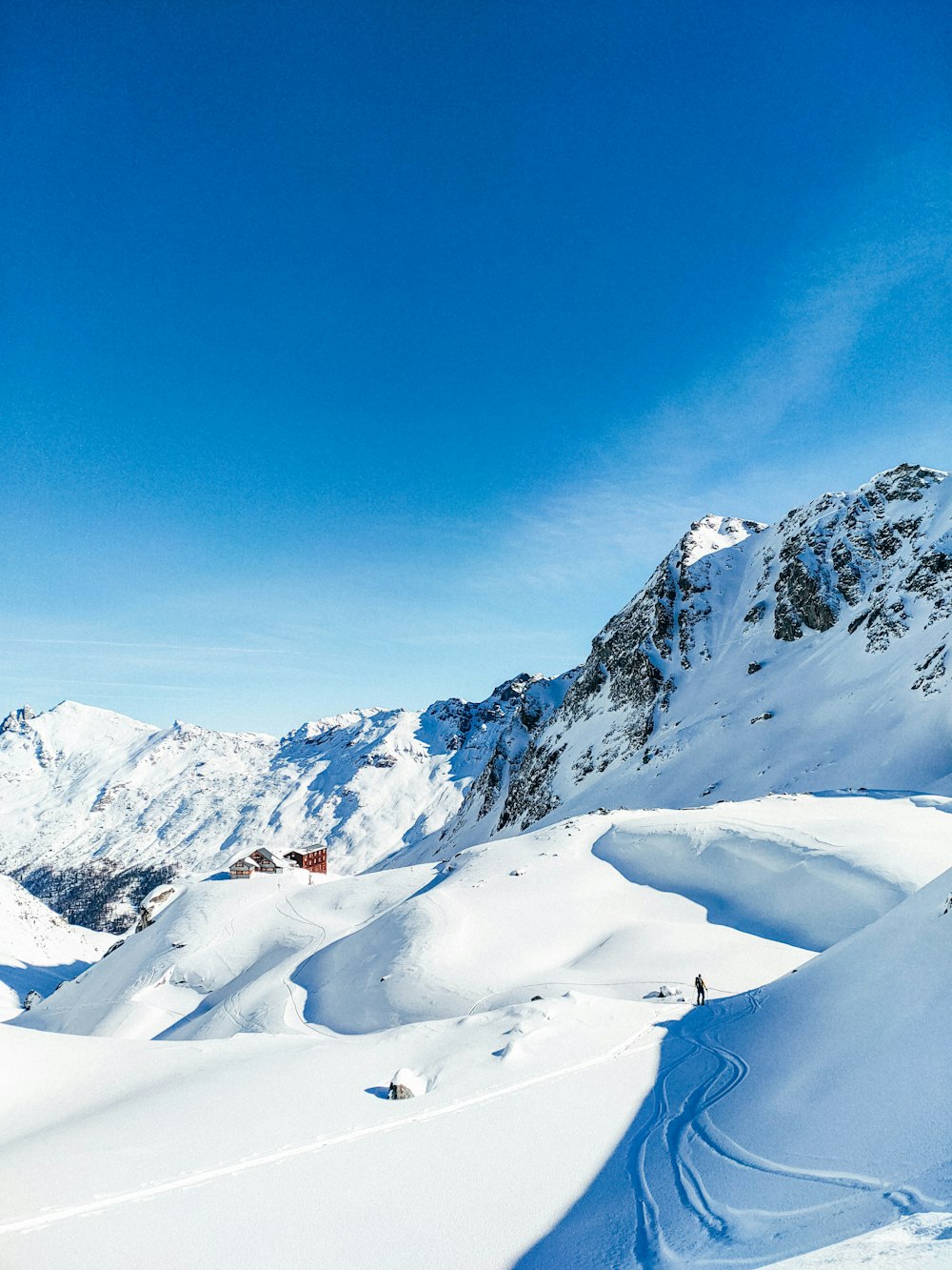 snow covered mountain under blue sky during daytime