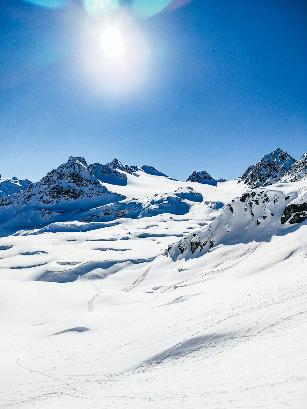 snow covered mountain under blue sky during daytime