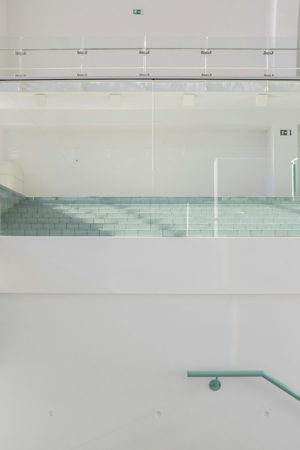 white ceramic bathtub with blue and white tiles