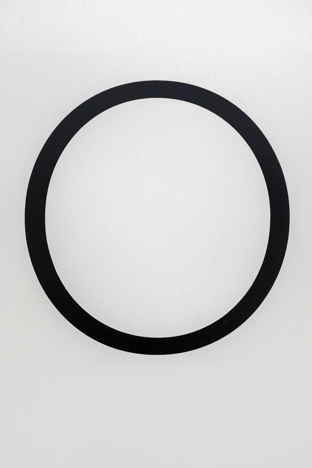 black round frame on white surface