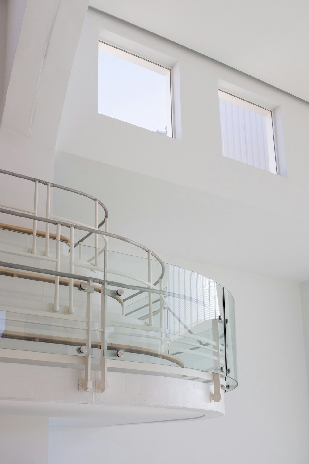 white metal staircase near white wall