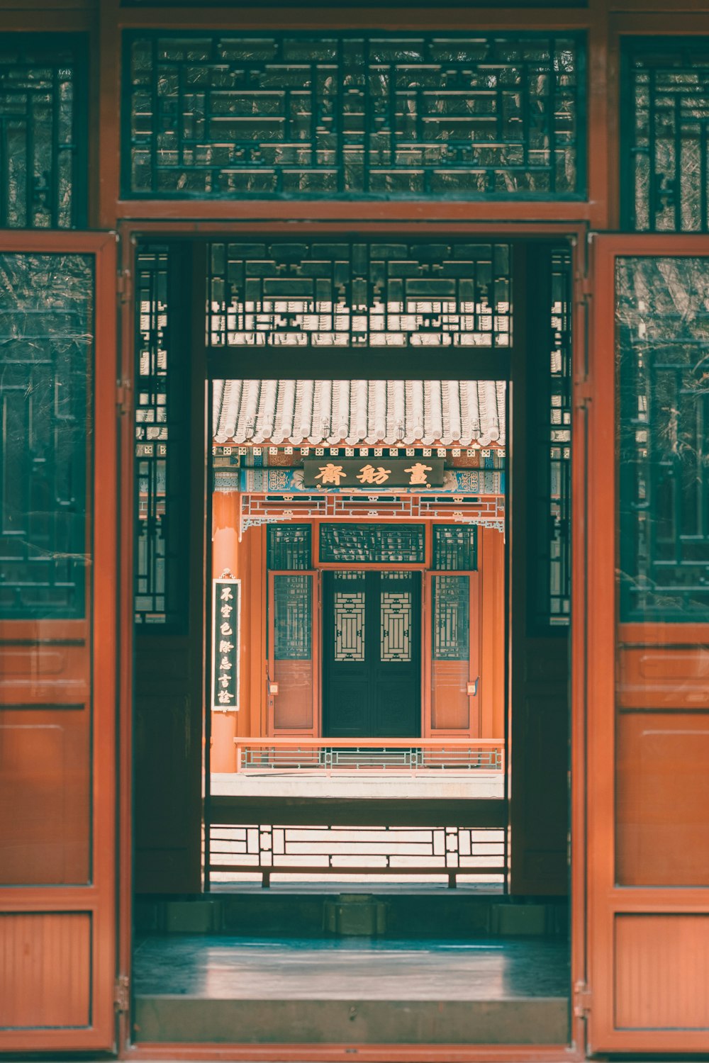 brown wooden framed glass door