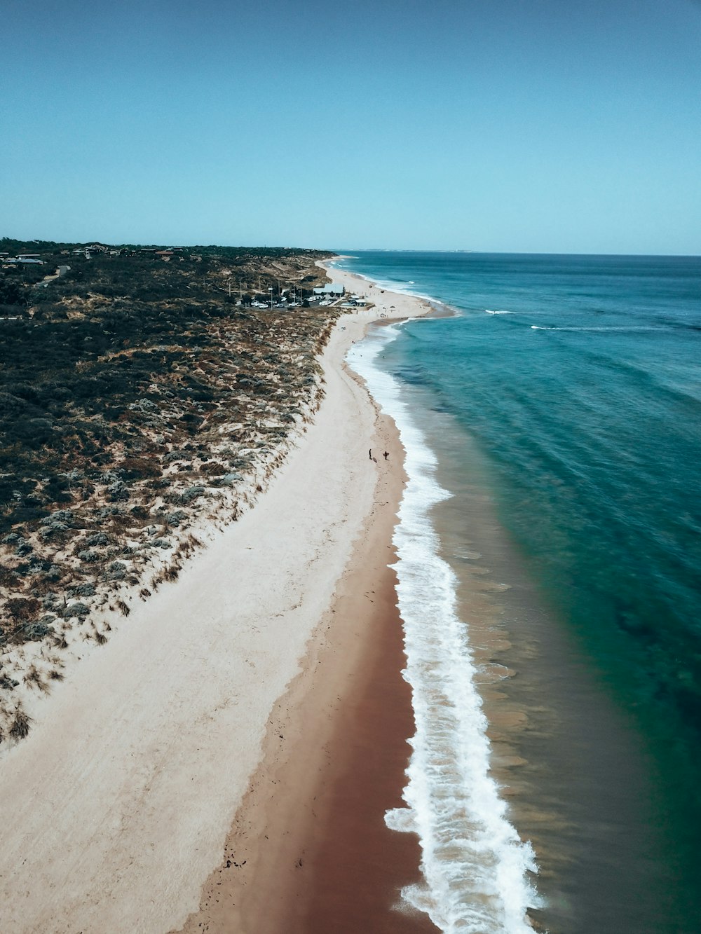 white sand beach during daytime