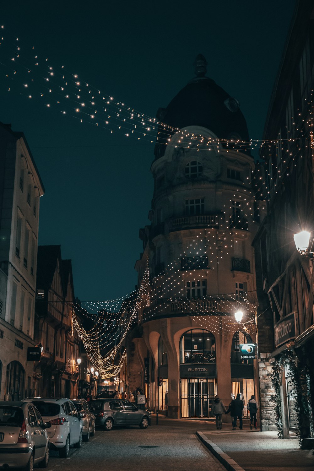 people walking on street during night time