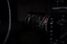 black camera lens on black surface