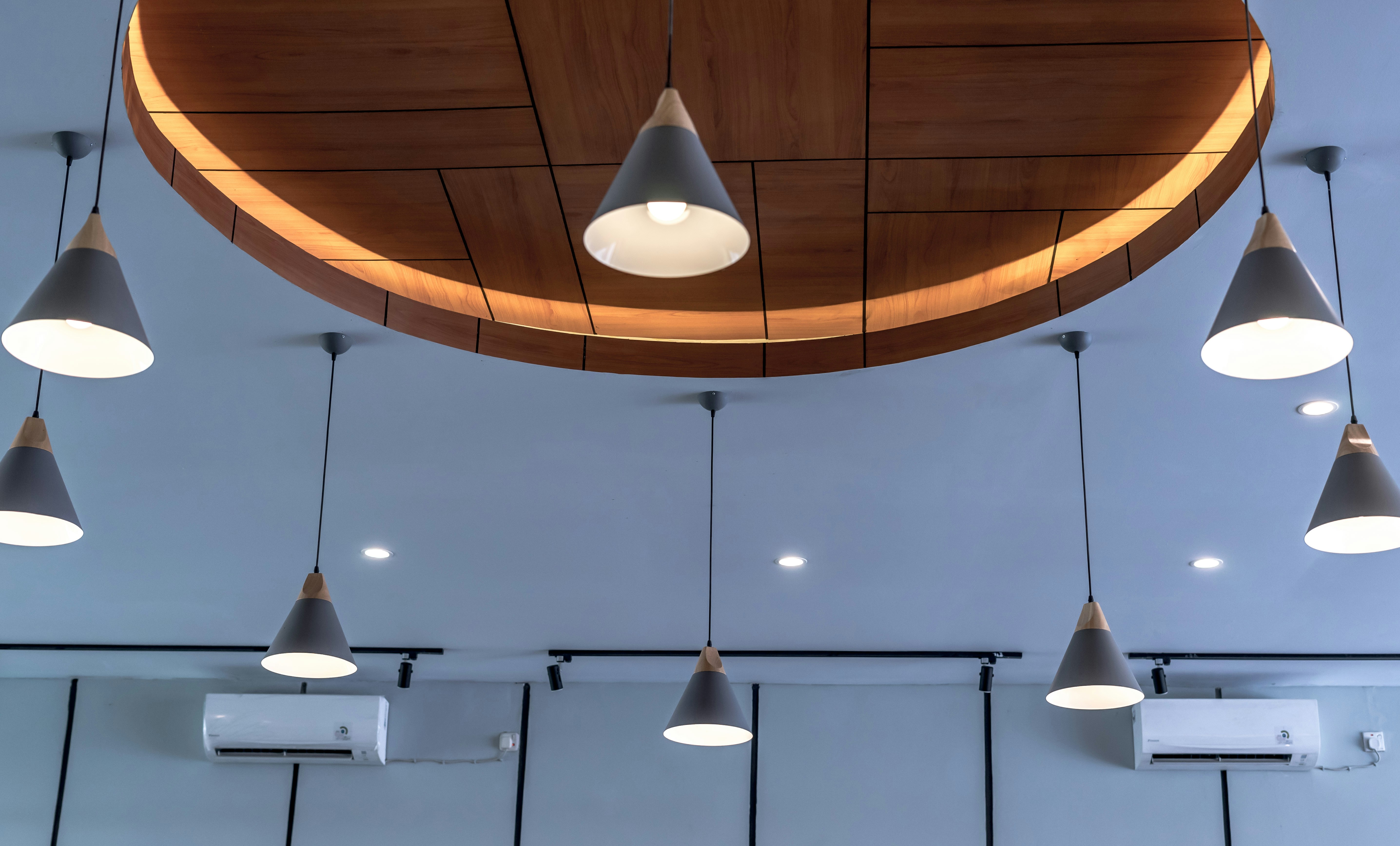 white pendant lamps turned on in room