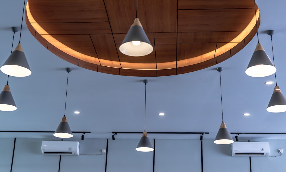 white pendant lamps turned on in room