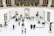 Visitors attentively watching a high-quality video gallery in an elegant online setting.