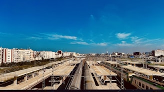 A panoramic view of a railway station equipped with modern signaling.