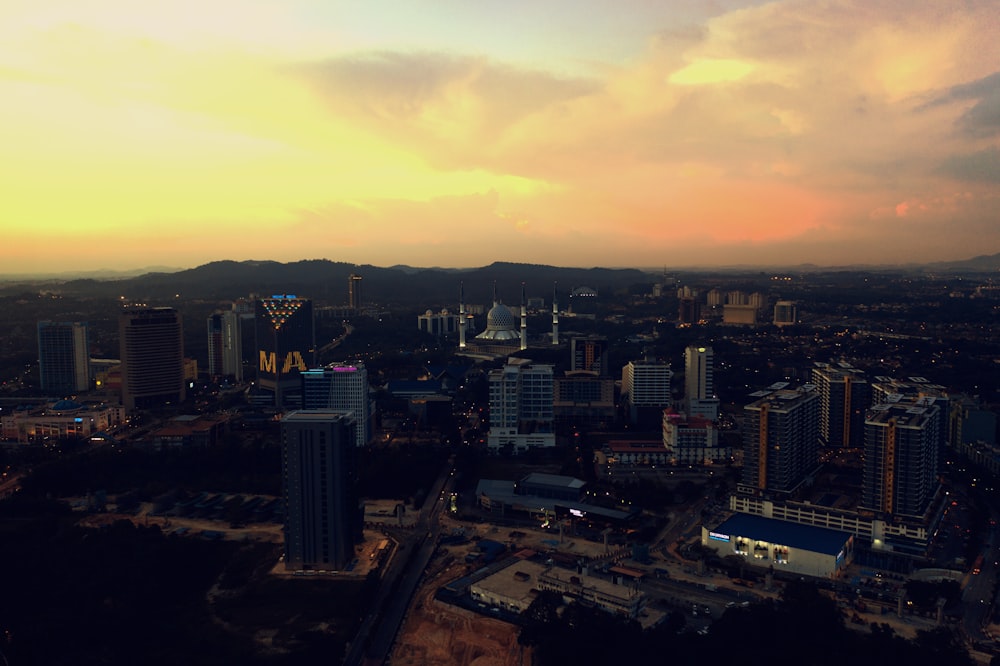 city skyline during sunset with cloudy sky