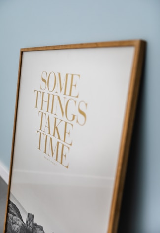 sign that reads some things take time symbolizing patience and consistency for healthy hair growth