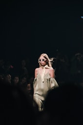 woman in white dress wearing sunglasses